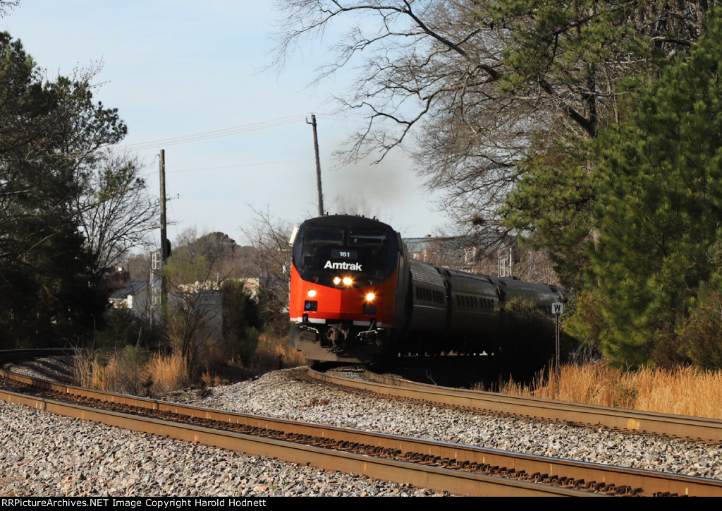 AMTK 161 leads train P080-05 away from the station